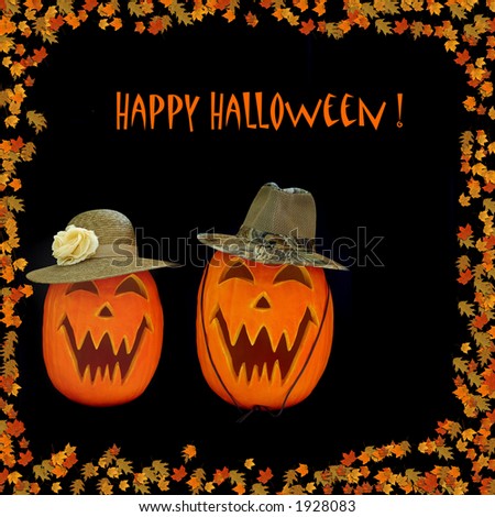 Happy Halloween Carved Pumpkins - Halloween Jack O Lanter couple wearing hats.  Colorful autumn leaves surround the pumpkins, isolated on black background with room for copy.