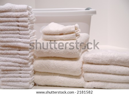 Laundry Day - Folded washcloths and towels stacked up on laundry day.