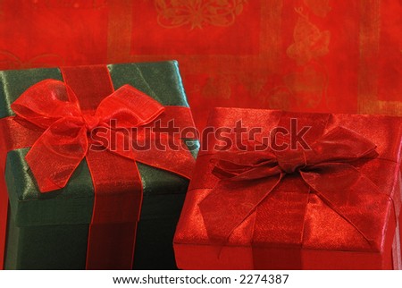 Holiday Gifts - Pretty gifts in fabric covered boxes with gossamer ribbons and bows for a special person.