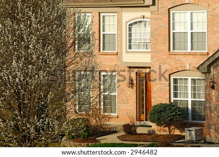 Residential Brick Home - Front entry to a typical two story brick home in the suburbs.