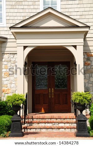 Leaded Glass Entry Door on a Brick and Stone Upscale Residence