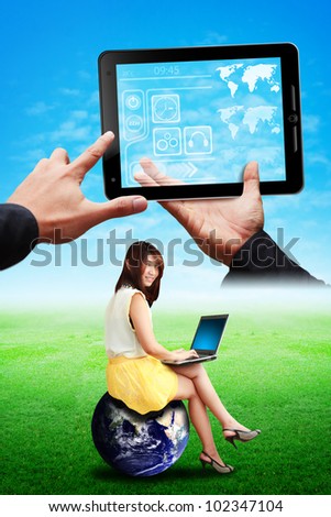 Lady on globe look at tablet computer on the sky : Elements of this image furnished by NASA