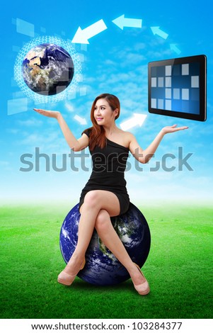 Lady on globe hold the world and touch pad : Elements of this image furnished by NASA