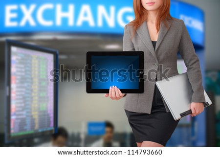 Business woman hold tablet for exchange rate report