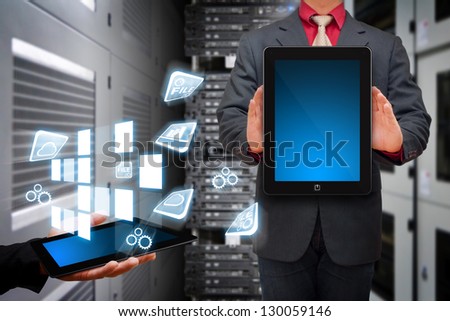 Programmer in data center room and icon control from digital tablet