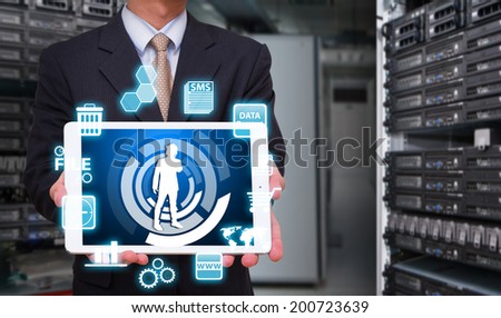Business man in data center room and icon control