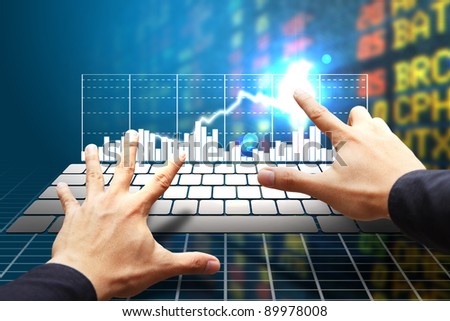 Smart hand typing on white keyboard and high graph stock exchange background