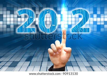 Smart hand press on the Digital background of 2012 year
