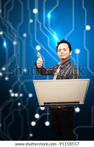 Business man hold notebook computer and thump up on digital background
