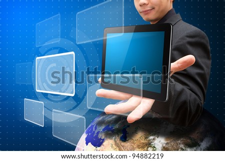 Smile Business man hold tablet computer on globe