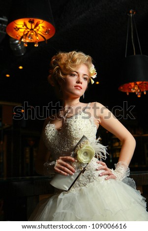 young elegant girl in a wedding dress in elegant dress with a stylish haircut