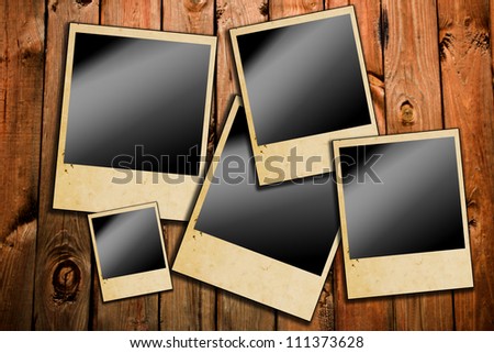 Photo frames on old aged wood background