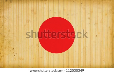 The flag of Japan on old and vintage bamboo texture