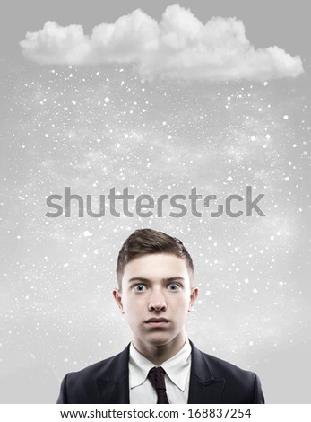 portrait of a pop-eyed man with snow falling on his head