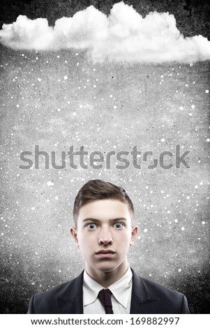 portrait of a pop-eyed man with snow falling on his head