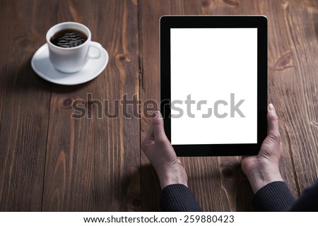 woman hand presses on screen digital tablet