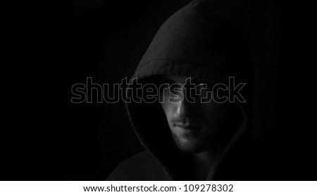 Portrait of a young angry man in the hood