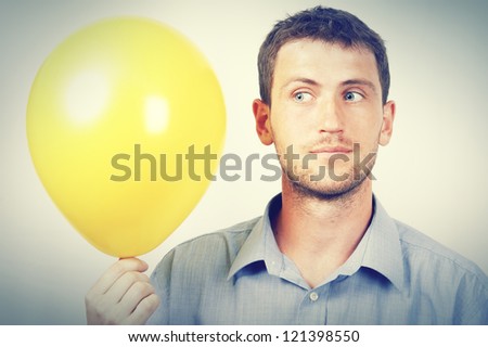 A man holding a balloon