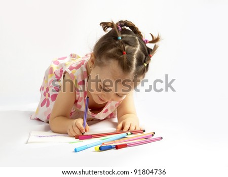 The beautiful girl drawing pencils in a sketch pad on the isolated white background