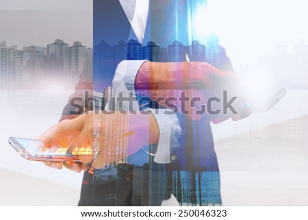 Businessman using digital tablet.double exposure of businessman.