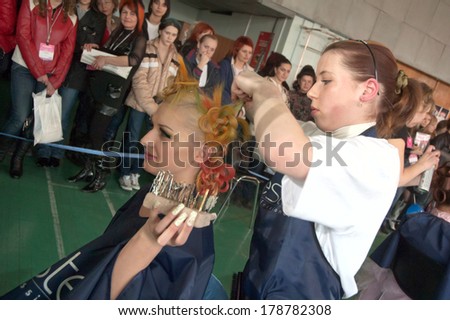 DNEPROPETROVSK, UKRAINE - MARCH 28: Stylist and his model prepar for the Championship on hairdressing, nail aesthetics and make YOUNG TALENTS OF UKRAINE on Mach 28, 2008 in Dnepropetrovsk, Ukraine