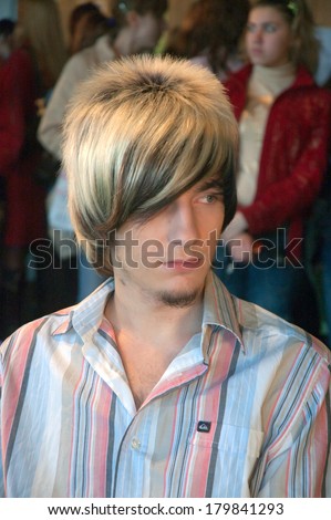 DNEPROPETROVSK, UKRAINE - MARCH 23: Model prepares backstage during the Championship on hairdressing, nail aesthetics and make YOUNG TALENTS OF UKRAINE on Mach 23, 2007 in Dnepropetrovsk, Ukraine