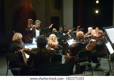 DNEPROPETROVSK, UKRAINE - MARCH 17: FOUR SEASONS Chamber Orchestra - main conductor Sergey Burko perform at the State Russian Drama Theatre on March 17, 2014 in Dnepropetrovsk, Ukraine