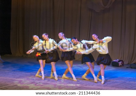 DNIPROPETROVSK, UKRAINE - May 22: Unidentified girls, ages 11-13 years old, perform DANCING at the State Palace of children and youth on May 22, 2014 in Dneiropetrovsk, Ukraine