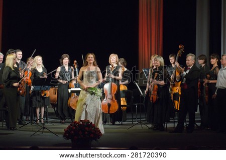 DNIPROPETROVSK, UKRAINE - MAY 26: Singer Nadezhda Eremenko and FOUR SEASONS Chamber Orchestra  - conductor Sergey Burko perform on May 26, 2015 in Dnipropetrovsk, Ukraine