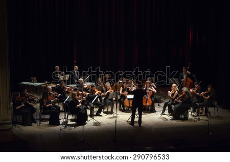 DNIPROPETROVSK, UKRAINE - JUNE 22, 2015:  FOUR SEASONS Chamber Orchestra - main conductor Dmitry Logvin perform at the State Russian Drama Theatre