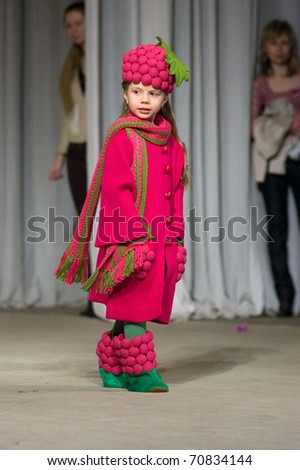 DNEPROPETROVSK, UKRAINE - MARCH 25: unidentified Ukrainian girl shows off his own clothes for unidentified young Ukrainian designer at FASHION TOWN  show on March 25, 2010 in Dnepropetrovsk, Ukraine