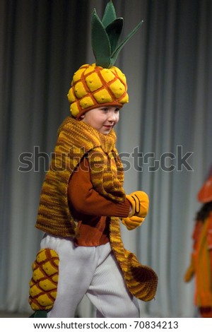 DNEPROPETROVSK, UKRAINE - MARCH 25: unidentified Ukrainian boy shows off his own clothes for unidentified young Ukrainian designer at FASHION TOWN  show on March 25, 2010 in Dnepropetrovsk, Ukraine