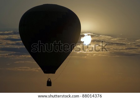Hot air balloon with setting sun