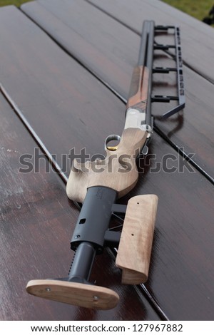 modern and stylish gun on wooden table