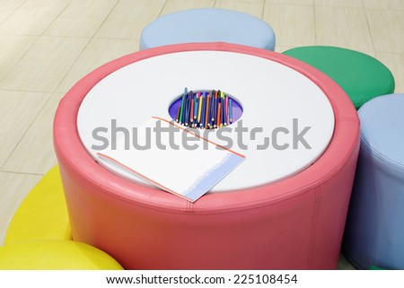 colorful kids place with pencils in clothing store