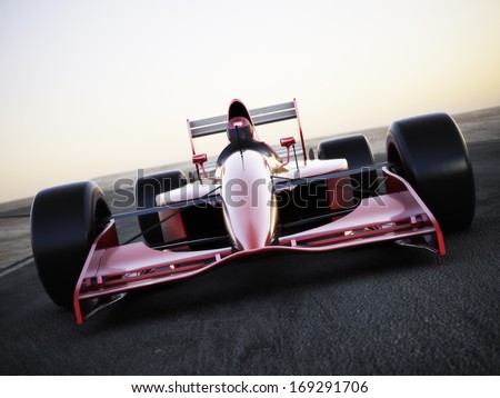 Race car racing on a track front view with motion blur