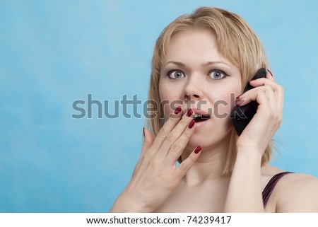 Emotion Woman  talking on a mobile on a blue background