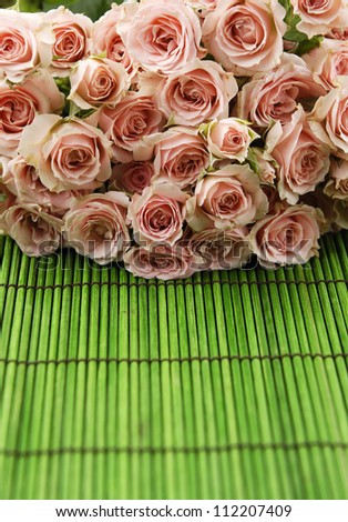 Big bouquet rose on green mat