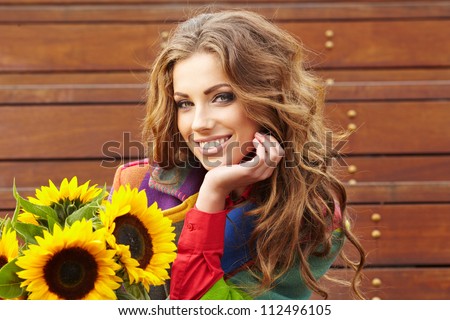 Autumn fashion woman with flowers