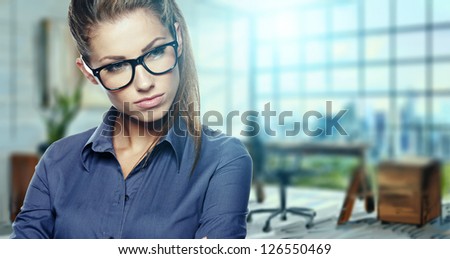 Closeup portrait of pretty cheerful business woman in an office environment