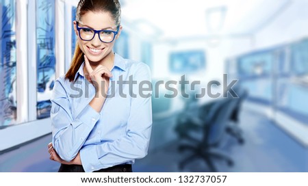 A portrait of a young business woman in an office