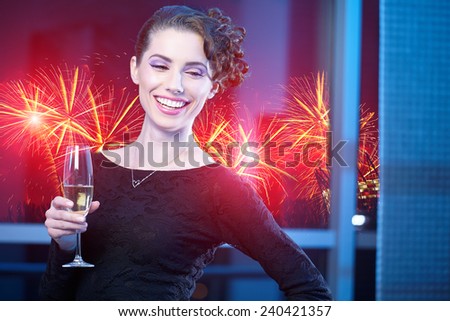 Portrait of a very fashionable, cool and elegant festive woman with champagne