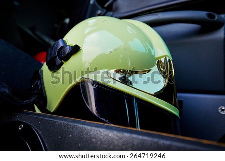 close-up picture of a white fire helmet on car seat