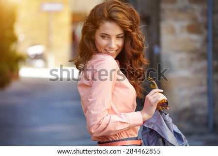 Beautiful woman on the streets of the old Italian town