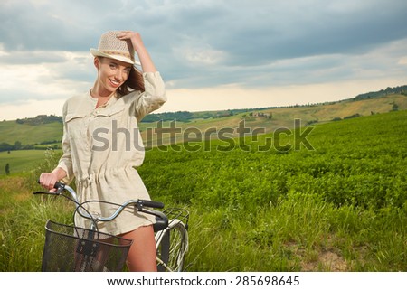 Beautiful vintage girl next to bike, summer Italy time