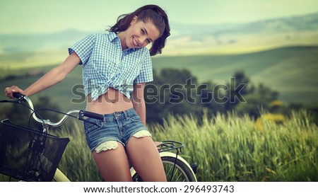 beautiful girl with vintage bike outdoor, summer time