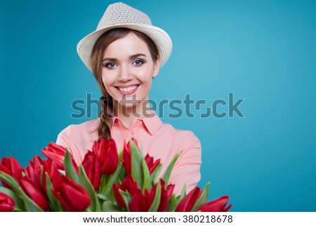 Young beautiful woman studio portrait with tulip flowers Stok fotoğraf © 
