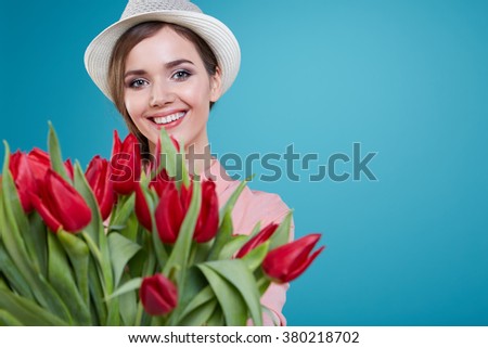 Young beautiful woman studio portrait with tulip flowers Stok fotoğraf © 