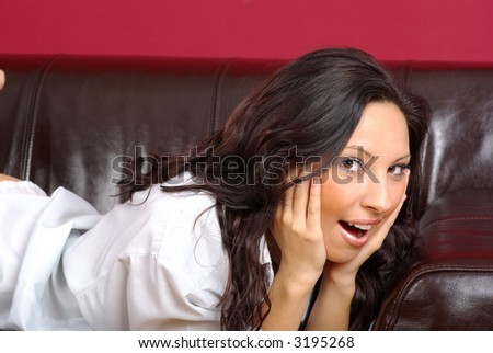 Beautiful woman lying on the couch in the living room