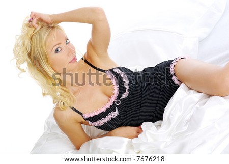 Sexy woman. sleepy blond laying in bed